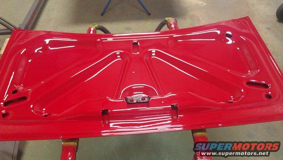 Underside of red car hood
