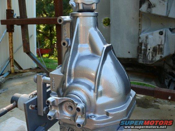 Differential housing with casting marks and mounting brackets, painted silver