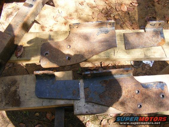 Rusted metal brackets on wooden planks