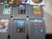 2004 Aston Martin Virage - A collection of classic Nintendo Entertainment System game cartridges and PlayStation 2 game cases are laid out on a surface.