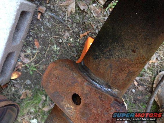 img_1183.jpg I wire wheeled the welds on the spring perches to see if they were bad. They look godd, but they still might need to be repaired or removed.