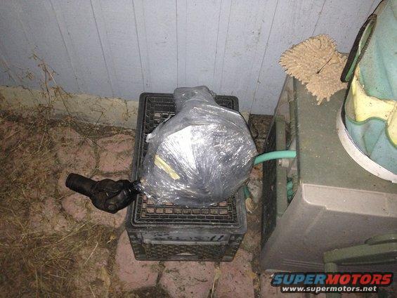 img_1186.jpg After running 2 cans of break cleaner through the differential to clean all the crud out, I wrapped it with about 10 layed of shipping grade plastic wrap to seal it from the element for now. It wont be able to go in the garage for a week or so.