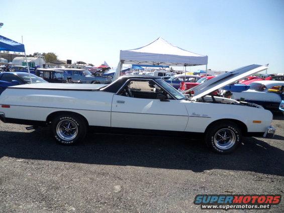 1973 Ford Ranchero parked at an outdoor event with hood open