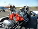 1973 Ford Ranchero - A dragster with twin V8 engines is prepared for an event, with a person attending to the rear tire.