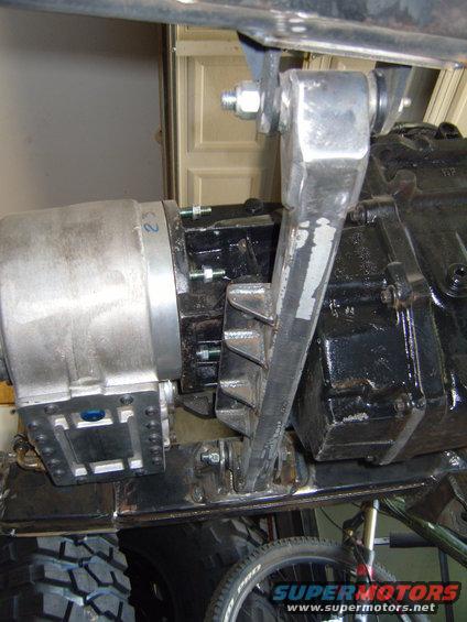 Transfer case and transmission assembly with visible bolts and metal brackets