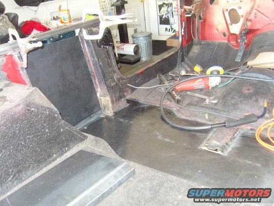 Interior of a vehicle with tools and repair materials visible