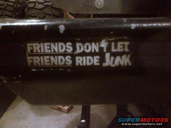 Black bumper with white text sticker reading "FRIENDS DON'T LET FRIENDS RIDE JUNK"