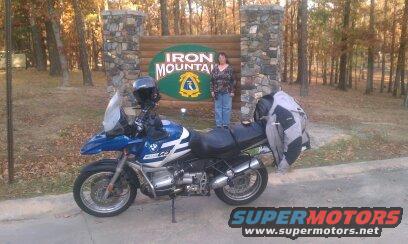 Blue and white 2001 BMW R1150GS ABS motorcycle parked in front of an Iron Mountain sign