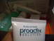 1993 Ford Probe - A collection of Proactiv Solution skincare products are visible inside a box, with one tube held in a hand.