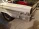 1964 Ford Fairlane - Front fender of a 1964 Ford Fairlane undergoing bodywork, with primer and filler visible.