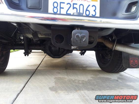 Pickup truck rear axle, bumper, and license plate. Chrome bumper is slightly dirty
