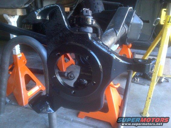 black suspension part on jack stands
