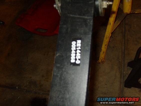 black part with white label reading RE1445-0 0054888