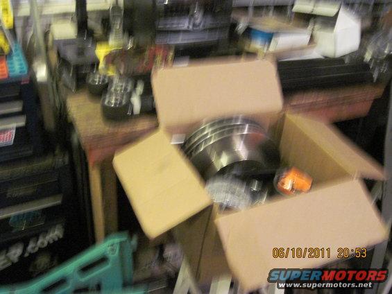box with brake rotors and an orange marker light inside
