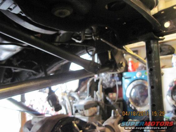 Undercarriage view of vehicle suspension components and frame