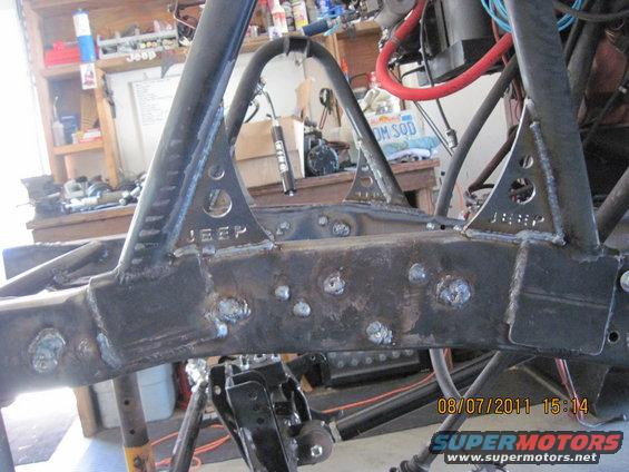 Custom welded Jeep frame section with 'JEEP' stamped on triangular brackets