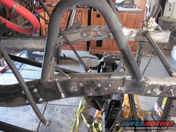 Jeep frame with roll cage tubing welded on. Some parts are bolted
