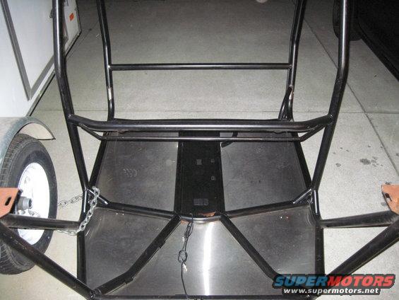 Roll cage interior with trailer hitch and wheel
