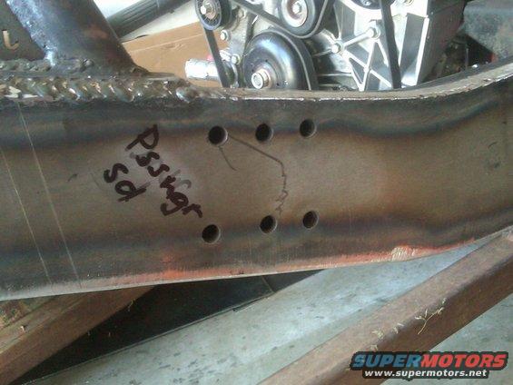 Vehicle frame with handwritten text 'Pssvgr sd' and engine components