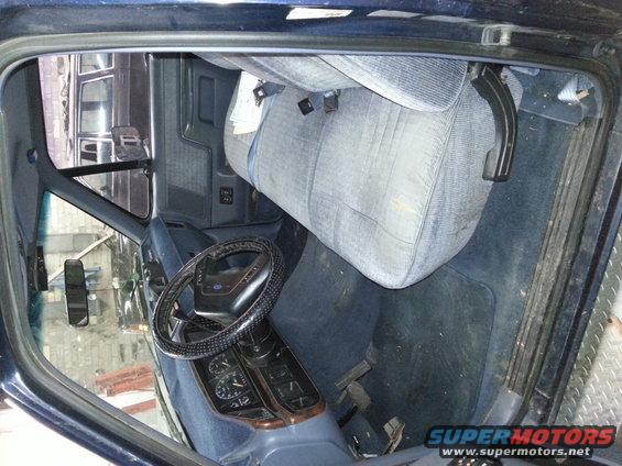 1989 Ford F-150 interior with blue cloth seats and dashboard