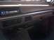 1994 Ford Bronco - The interior dashboard features an aftermarket stereo and climate controls, with a small open compartment below.