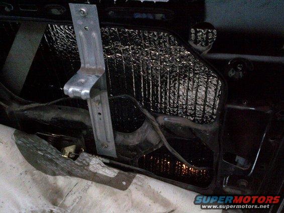 Interior of a car door with sound deadening insulation applied