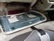1994 Ford Crown Victoria - The interior of a vehicle shows a removed door panel, revealing the underlying structure and car seats.