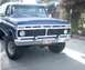 1991 Ford Bronco - Front view of a blue Ford truck, showing its grille, headlights, and bumper.