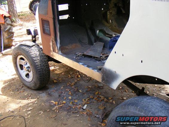 1978 Ford Bronco body undergoing restoration, showing interior floor and fender area