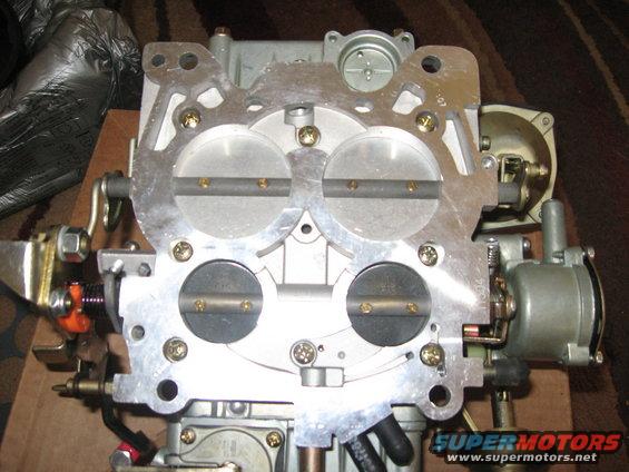 Holley 4-barrel carburetor with visible throttle plates and linkage