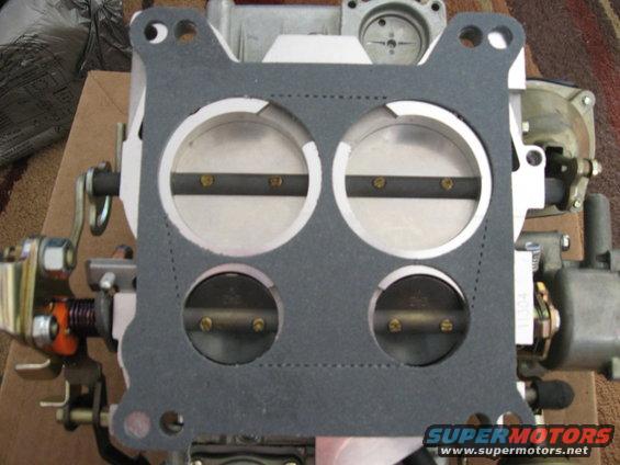 Carburetor with a new gasket installed over the throttle plates