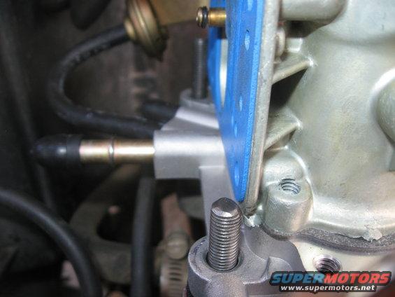 Carburetor with blue gasket and metal fittings