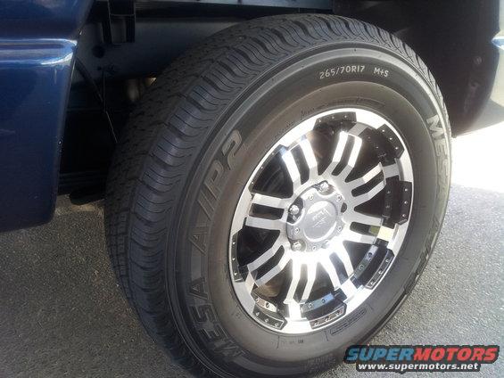 Blue truck wheel with chrome and black spokes, tire size 265/70R17