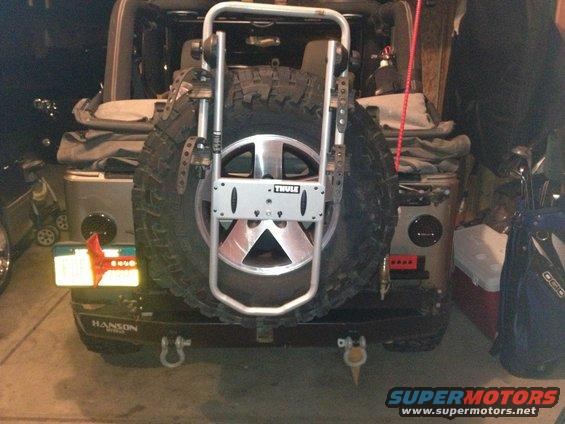 Rear of Jeep Wrangler with Thule spare tire carrier and spare tire mounted