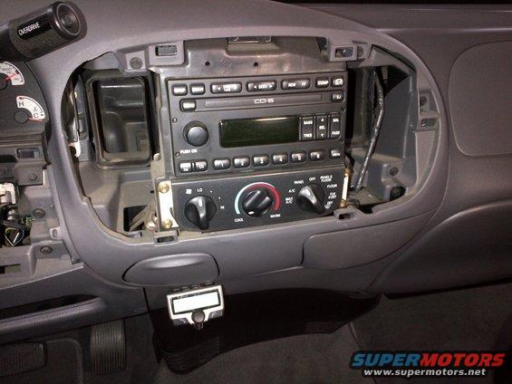 Interior dashboard of a 2003 Ford F-150 with radio and climate controls removed