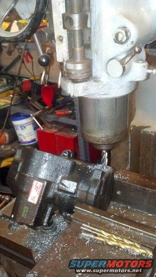 img_20130918_233442_904.jpg Milling 7/16" hole for right hand turn pressure port in the thick boss down near the bottom end of the box.  The hole should penetrate into the oil passage that is under that long ridge.  I picked this spot because it is thick here and has plenty of beef to thread into, but won't let the adapter interfere with the movement of the piston.