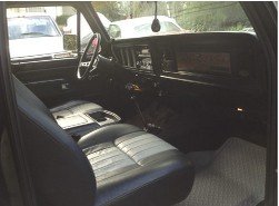 1978 Ford Bronco interior with striped seats and dashboard