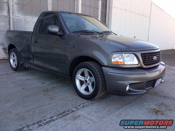 Dark gray Ford F-150 Lightning pickup truck parked outside
