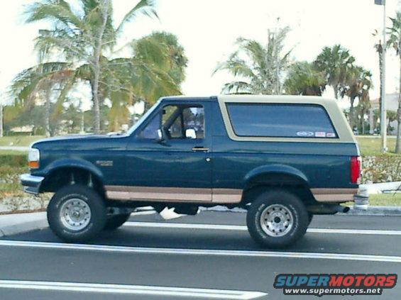 cimg0005.jpg Shortly after lift. Eddie Bauer tan has been painted black and now sports 33'' Pro Comps on Black steel wheels