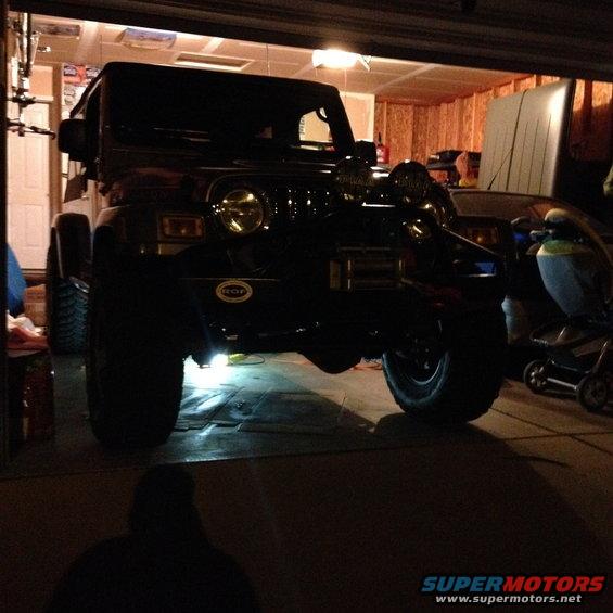 Black 2005 Jeep Wrangler front view in garage