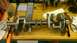2005 Chevrolet Suburban - A crankshaft is shown on a workbench, surrounded by various tools and a socket set.