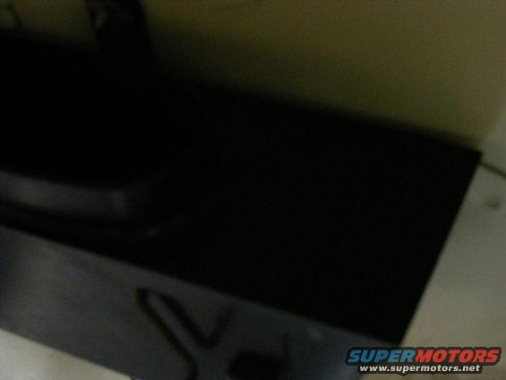Black car part with 'SUPERMOTORS' logo and website at the bottom right