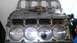 2005 Chevrolet Suburban - Close-up view of an engine block's cylinder heads and pistons, with measurement markings visible.
