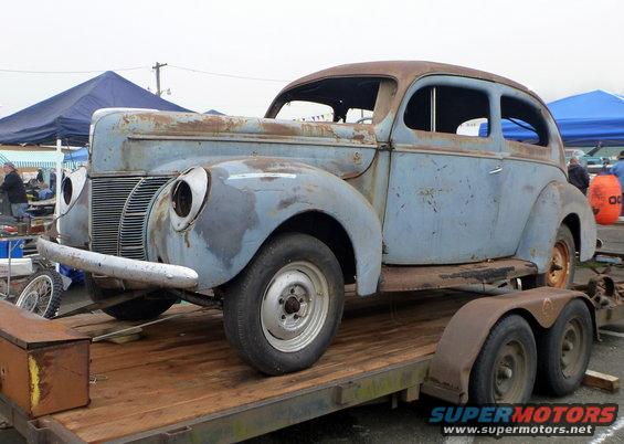 1940 Ford Sedan on trailer, front 3/4 view, light blue