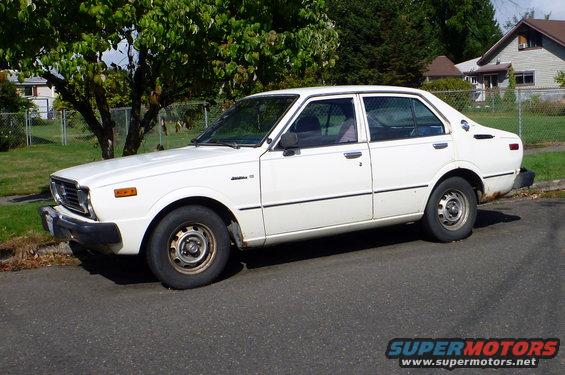 White sedan with a side view, circa 1980