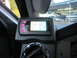 2008 Ford F-450 - A digital gauge display with pink buttons is mounted inside a vehicle, showing various readings.