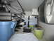 2008 Ford F-450 - The interior of a vehicle's cargo area is filled with various storage containers and folded seating components.