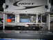 2008 Ford F-450 - Storage compartments of a truck camper are open, revealing organized and unorganized items within.