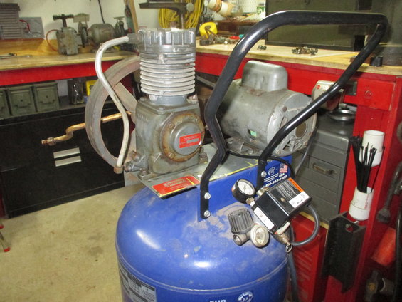 Blue air compressor with gauges and motor