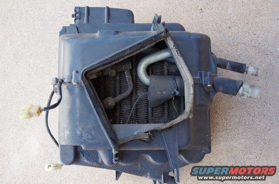 Car heater core assembly with hoses and electrical connectors